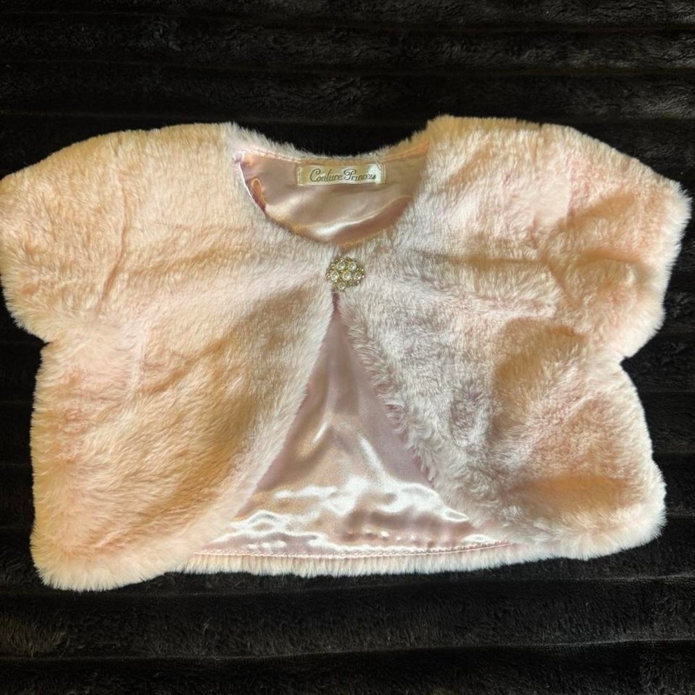 Pink faux fur bolero jacket with satin lining and rhinestone brooch